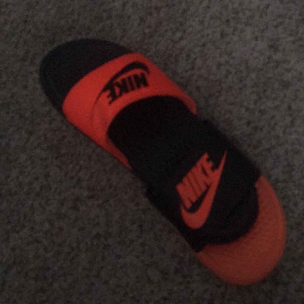 Woman’s size 7 orange and black slides
